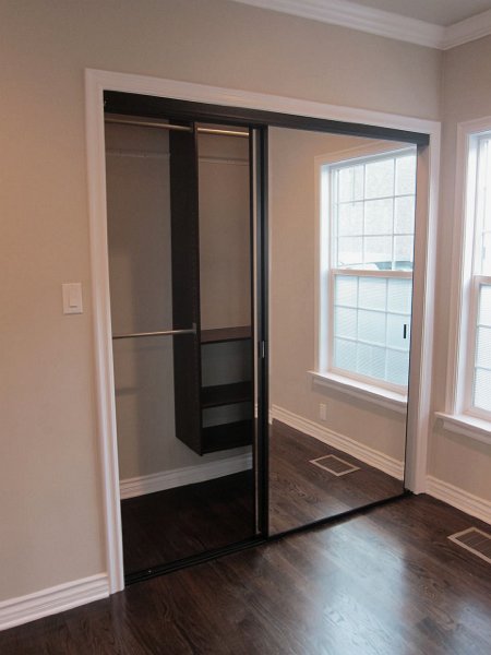 Closets with mirror doors and organizer